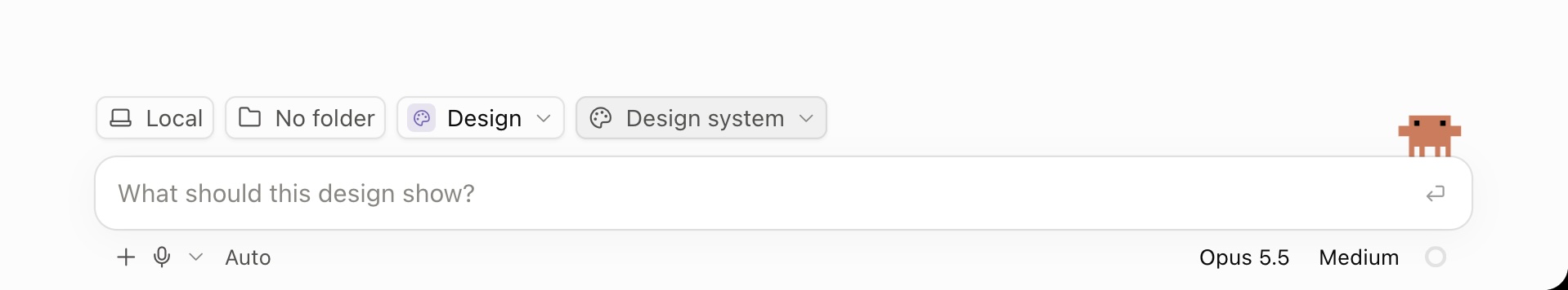 Claude Code input bar in Design mode with a Design system picker next to it and the placeholder 'What should this design show?